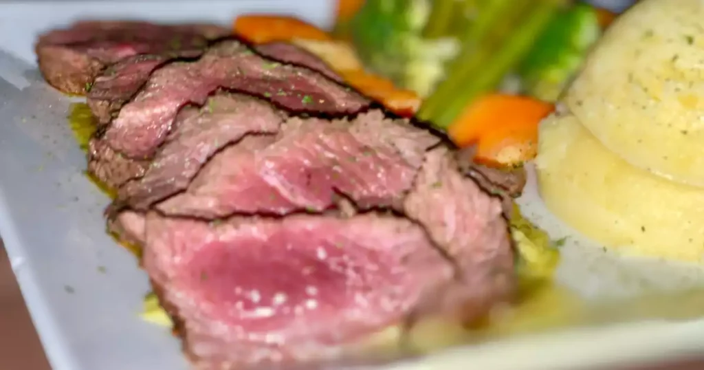A steak lovers’ paradise at SXM in Simpson Bay featuring juicy premium steaks, gourmet sides, and a vibrant dining experience near the marina for food enthusiasts.