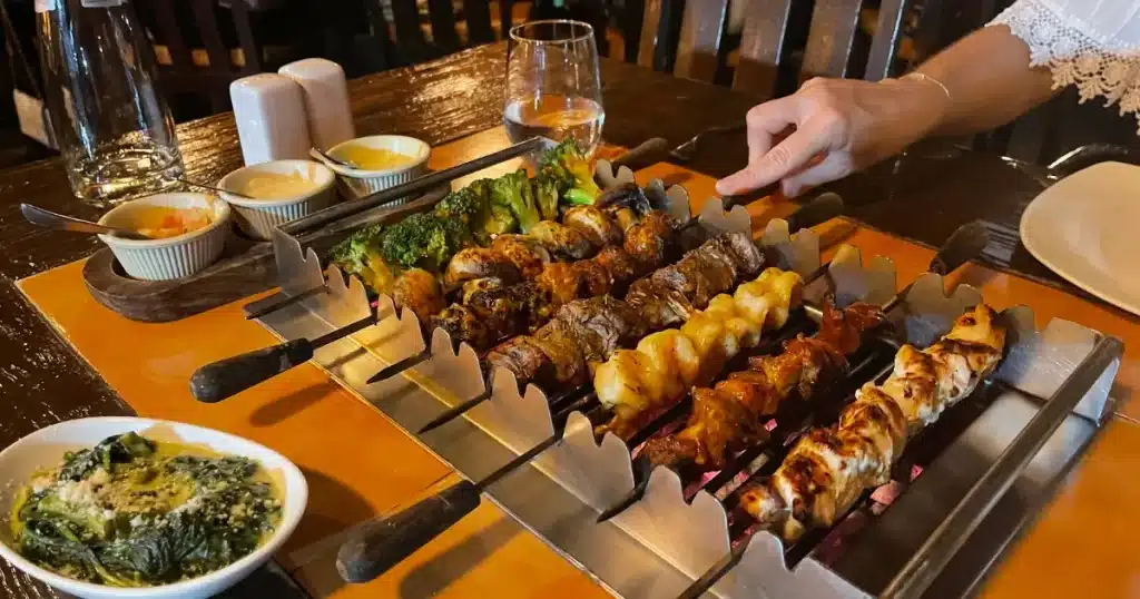 Tabletop cooking experience at We Are SXM featured restaurant Mélange Grill in Simpson Bay, offering an interactive dining experience in St. Maarten.