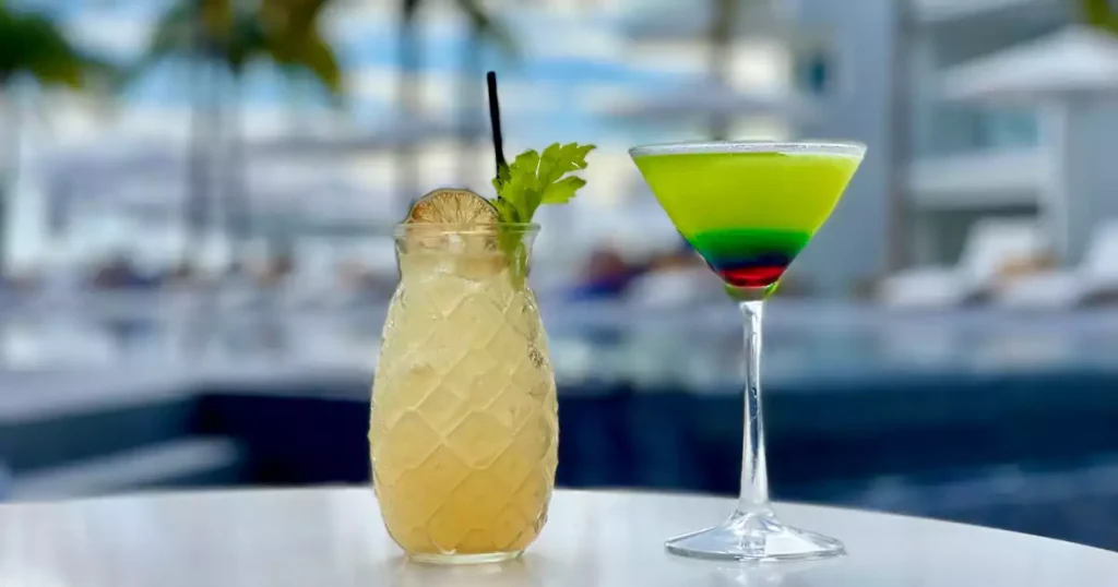Guests enjoying cocktails and drinks at the bar of Salt Restaurant in Simpson Bay, St. Maarten.