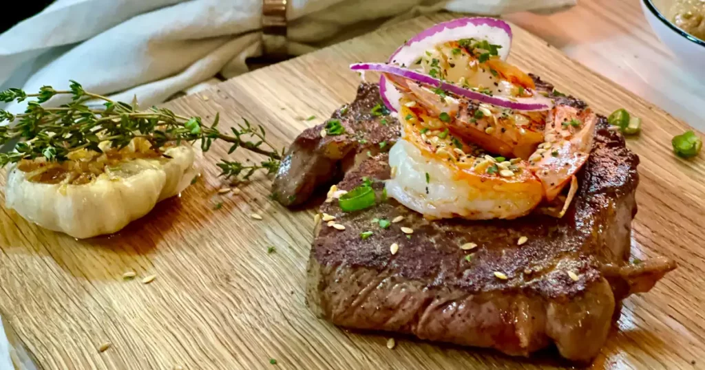 Savoring premium steaks at SXM’s finest restaurants in Simpson Bay, featuring expertly cooked cuts, gourmet sides, and a memorable dining experience near the marina.