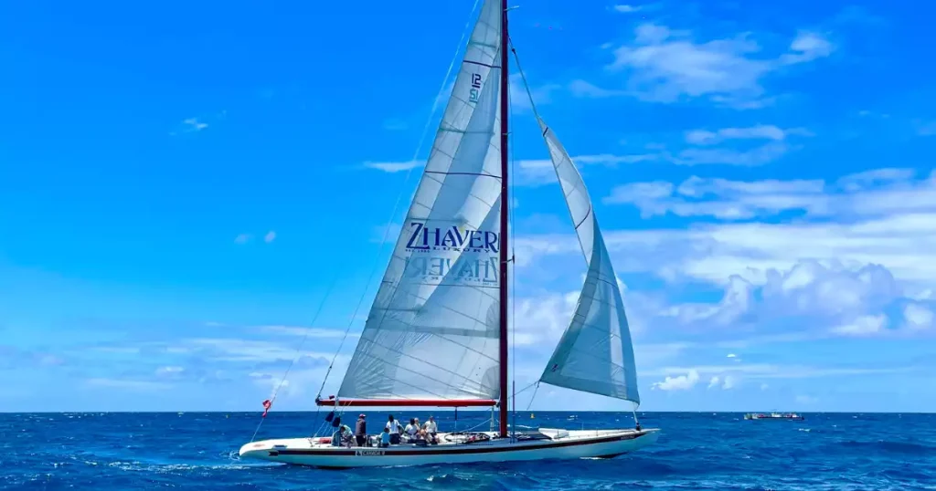 Sailing regatta in St. Maarten featuring colorful sailboats racing across turquoise waters near Philipsburg and Simpson Bay for spectators and visitors