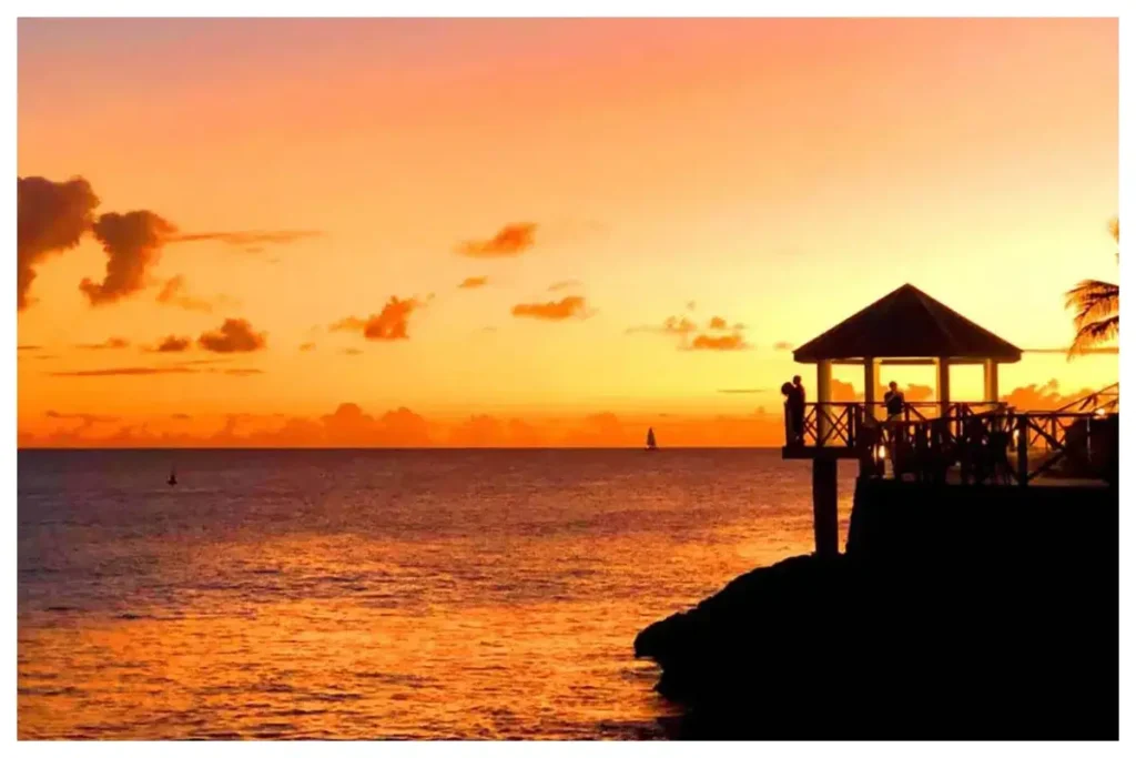 Beautiful sunset over Maho Beach in St. Martin with vibrant skies, calm waters, and scenic views ideal for photography, relaxation, and island experiences.