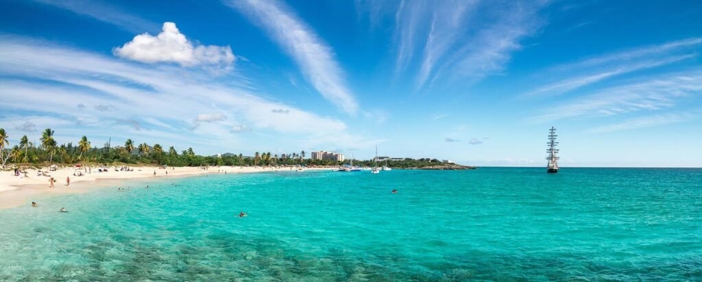 Scenic view of Mullet Bay in St. Maarten, highlighting the island’s friendly atmosphere, beaches, and local attractions for vacationers and travelers.